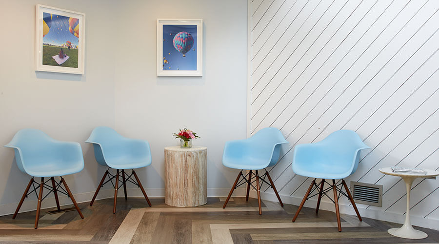 blue chairs in waiting area of embrace orthodontics