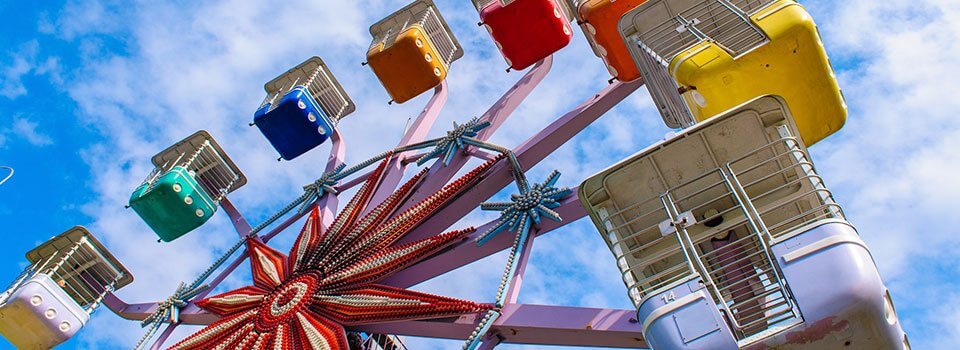 a colorful ferris wheel on a sunny day