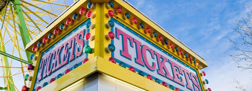 a colorful carnival ticket booth